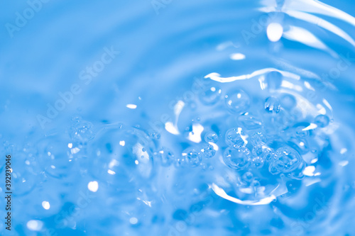 Water drop abstract background, fresh an clean background image. Blurred wave and drop in trasparent, clear liquid. Health and safe environment concept