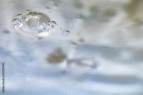Water drop abstract background, fresh an clean background image. Blurred wave and drop in trasparent, clear liquid. Health and safe environment concept