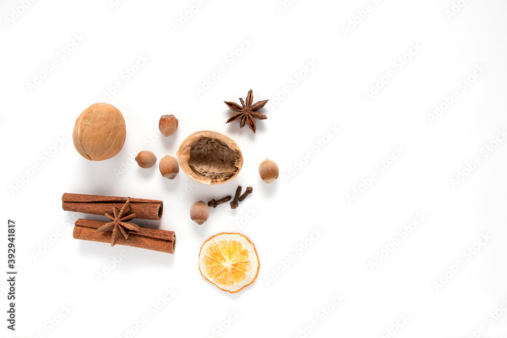 Nuts and spices for christmas cake on white background. Nuts and spices for christmas cake on white background.