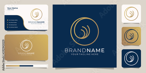 combination of moon and wind symbols, in a minimalist style. The golden and blue color palette stand out as an opulent color combination, giving it a luxurious dash.logo and business card template.