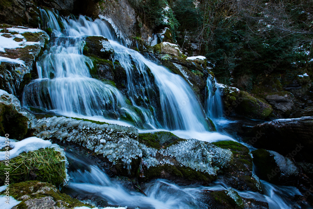 Fototapeta premium Winter in Llobregat river waterfall, Barcelona, Pyrenees, Spain
