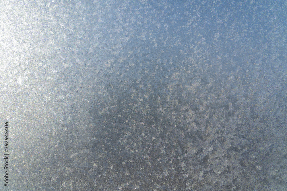 Frozen window glass covered with frost Frozen window glass covered with frost