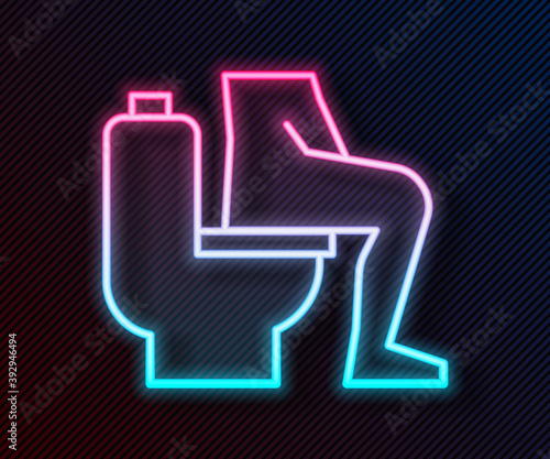 Glowing neon line Men sitting on the toilet and Constipation are experiencing severe abdominal pain icon isolated on black background. Vector.