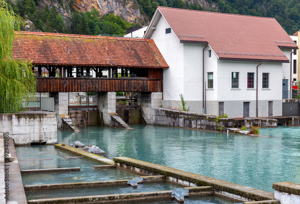 Interlaken. Old wooden dam on the mountain river Aare.