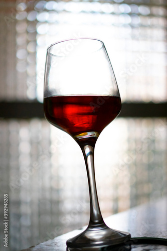 Glass of red wine on white background. photo