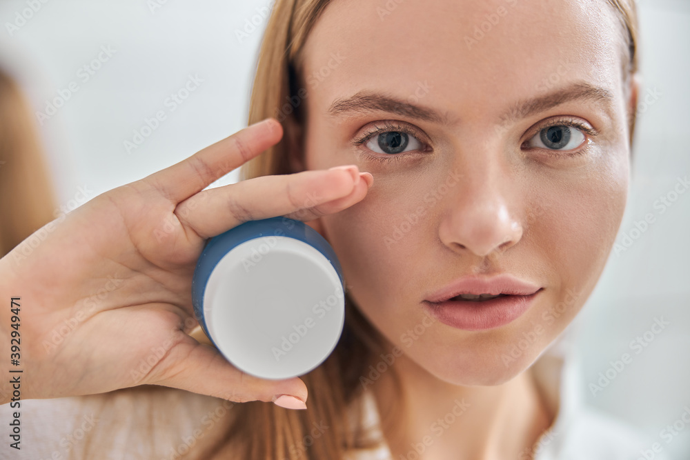 Young female with natural healthy fresh skin at home bathroom Young female with natural healthy fresh skin at home bathroom