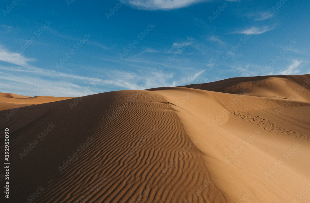 landscape with desert dunes and blue sky