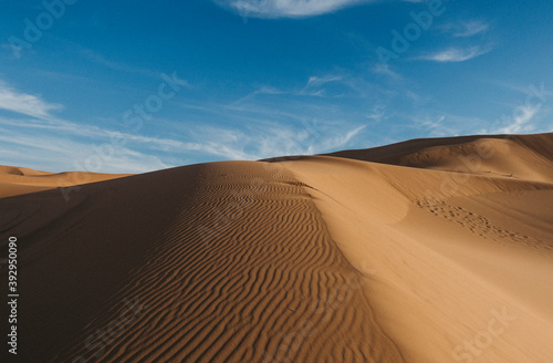 landscape with desert dunes and blue sky