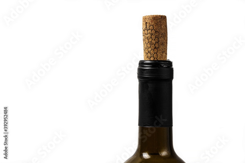 Wine green bottle with open cork on white background.Close up photo. Wine stopper isolated. Place for text or logo.