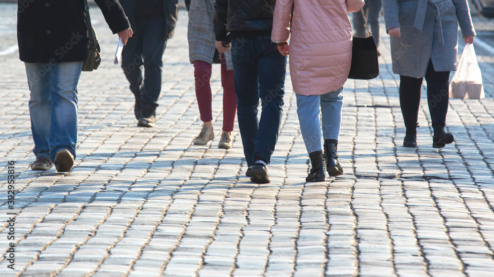 people walking on the street pavement