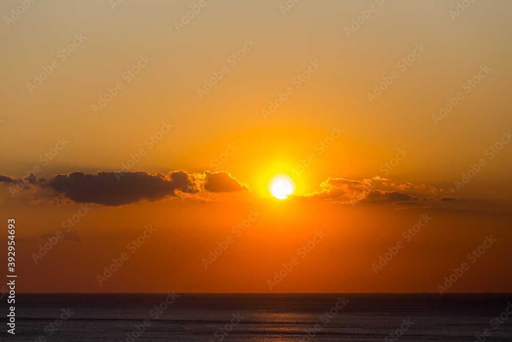 Beautiful sunset over the sea orange coclor.