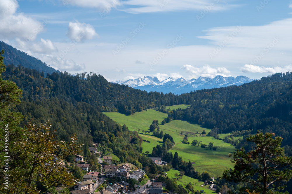 Aerial View alp mountains In South Tyrol region in Italy with a village in the valey. Aerial View alp mountains In South Tyrol region in Italy with a village in the valey.