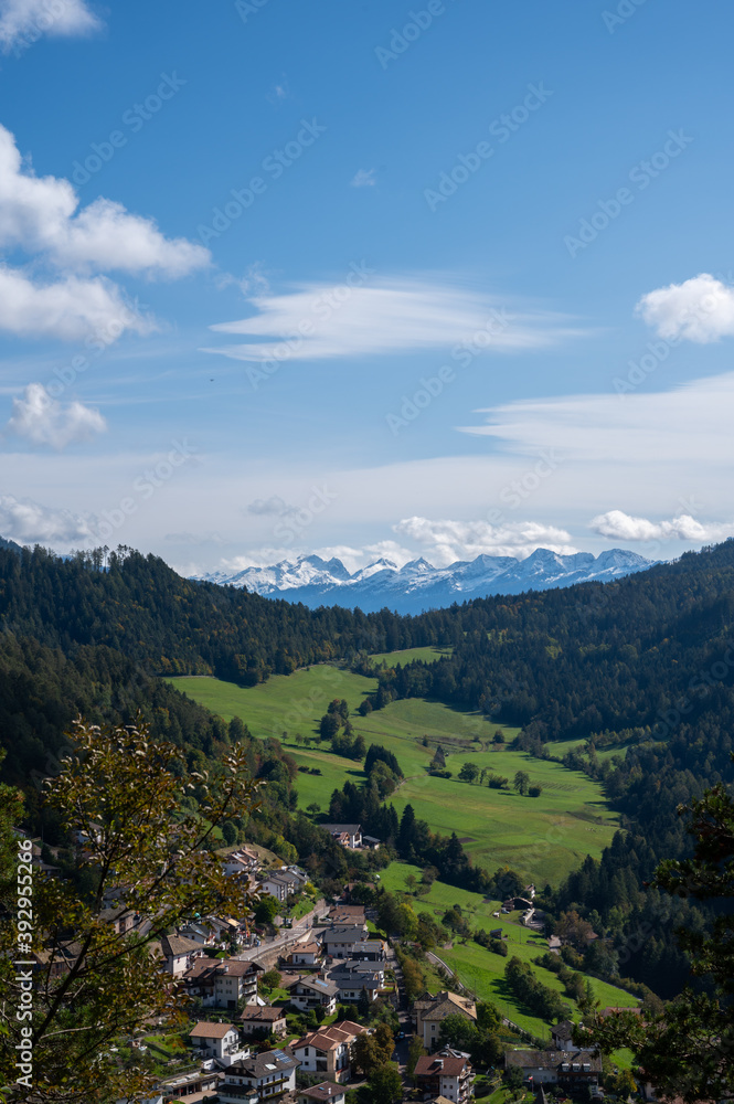 Aerial View alp mountains In South Tyrol region in Italy with a village in the valey. Aerial View alp mountains In South Tyrol region in Italy with a village in the valey.