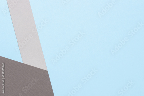 Abstract geometric texture background of fashion pastel blue and gray tone color paper. Top view, flat lay