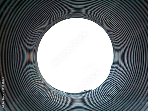 The texture of the metal corrugated ventilation pipe. Metal corrugation texture. Ventilation pipe. Hood. Embossed metal. Iron. Air conditioning duct. Intake hood air duct. Look into the pipe. photo