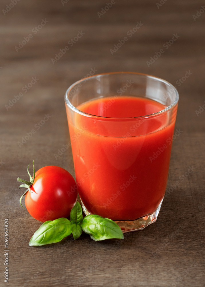 Tomato juice in a glass. Close-up. Tomato juice in a glass. Close-up.