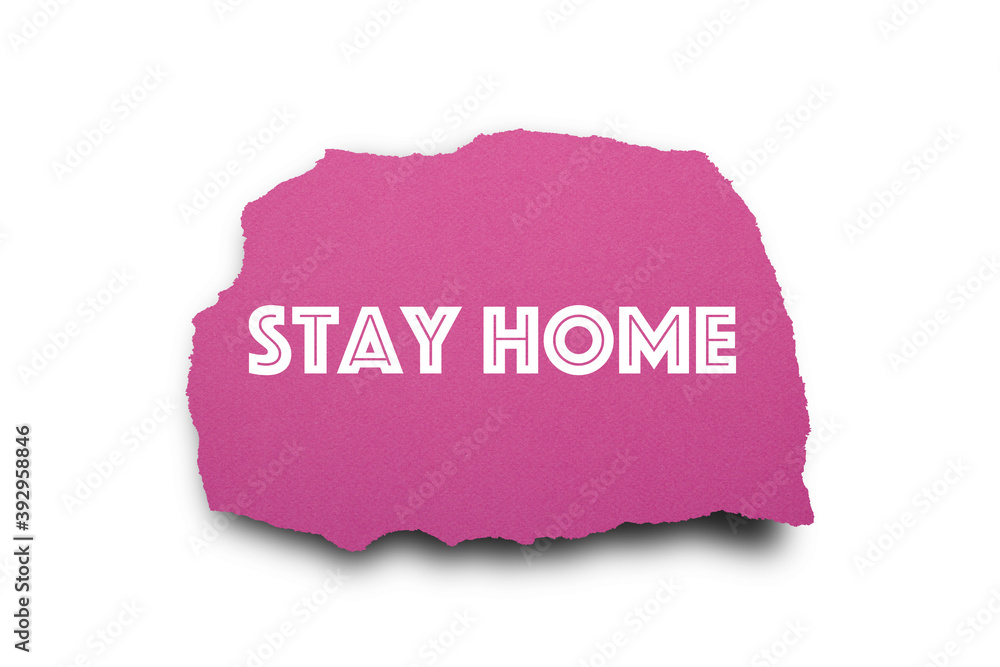 Stay Home written under torn paper. Stay Home written under torn paper.