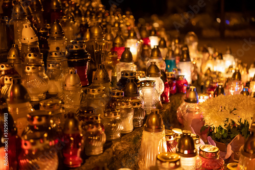 Candles on the grave. Cemetery. © Bogumił Dłubek
