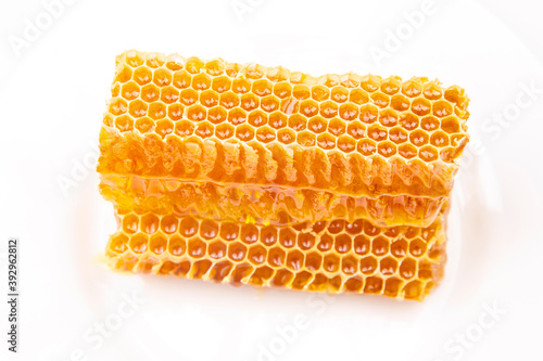pieces of beeswax honey on a white background