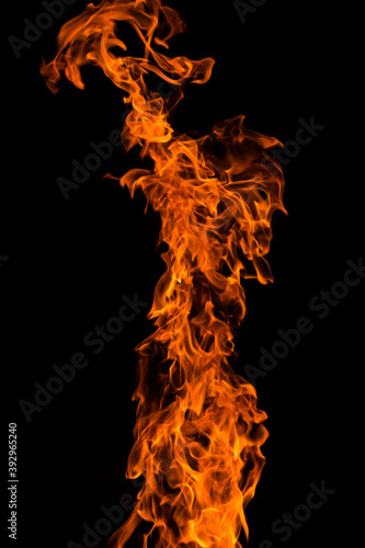 Bright orange red Fire flame on black background, abstract texture