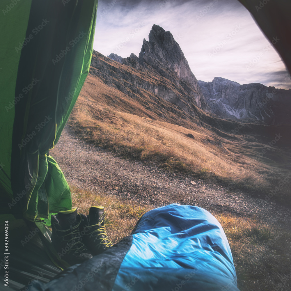 Postcard view from tent to Geisler mountains. Dolomites, South Tyrol, Italy. Colored square landscape. Unesco World Heritage site.