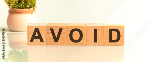 Tableau sur toile avoid motivation text on wooden blocks business concept white background