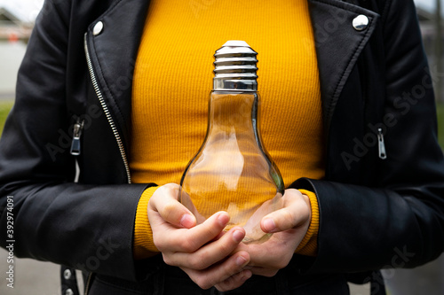 Woman holding a light bulb. photo