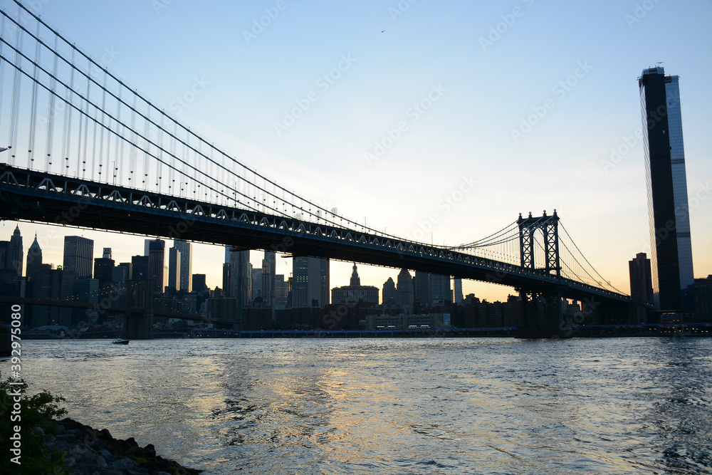 Brooklyn, USA - May 27, 2019: Sunset view to Manhattan from Main Street Park near Brooklyn Bridge