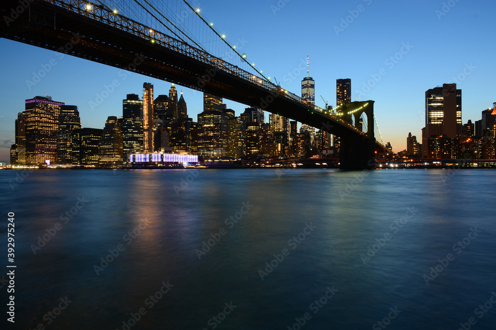 Brooklyn, USA - May 27, 2019: Night view to Manhattan from Main Street Park near Brooklyn Bridge