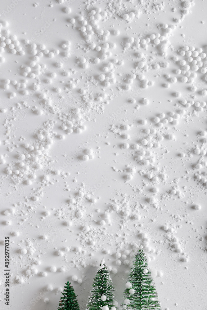 Christmas trees in the snow. New Year's decor. Christmas or winter composition. Snowflakes and snowball on a white background.Christmas, winter, new year concept. Christmas trees in the snow. New Year's decor. Christmas or winter composition. Snowflakes and snowball on a white background.Christmas, winter, new year concept.