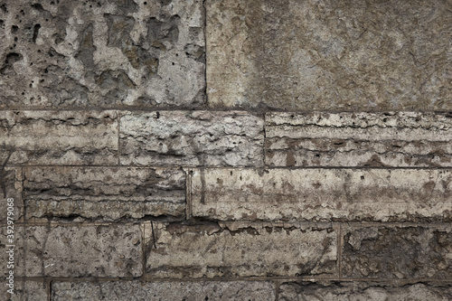 texture of the grey concrete wall of an old building