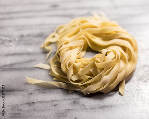 Pile of Fresh Fettuccine Pasta Noodles photo