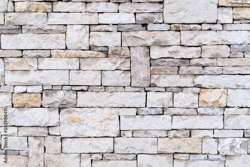 wall texture made of cut stone. stone wall background. wall texture made of cut stone. stone wall background.