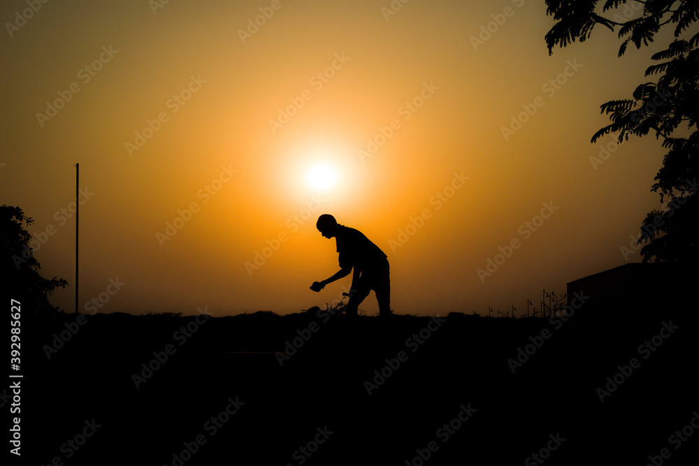 silhouette of a person during sunset