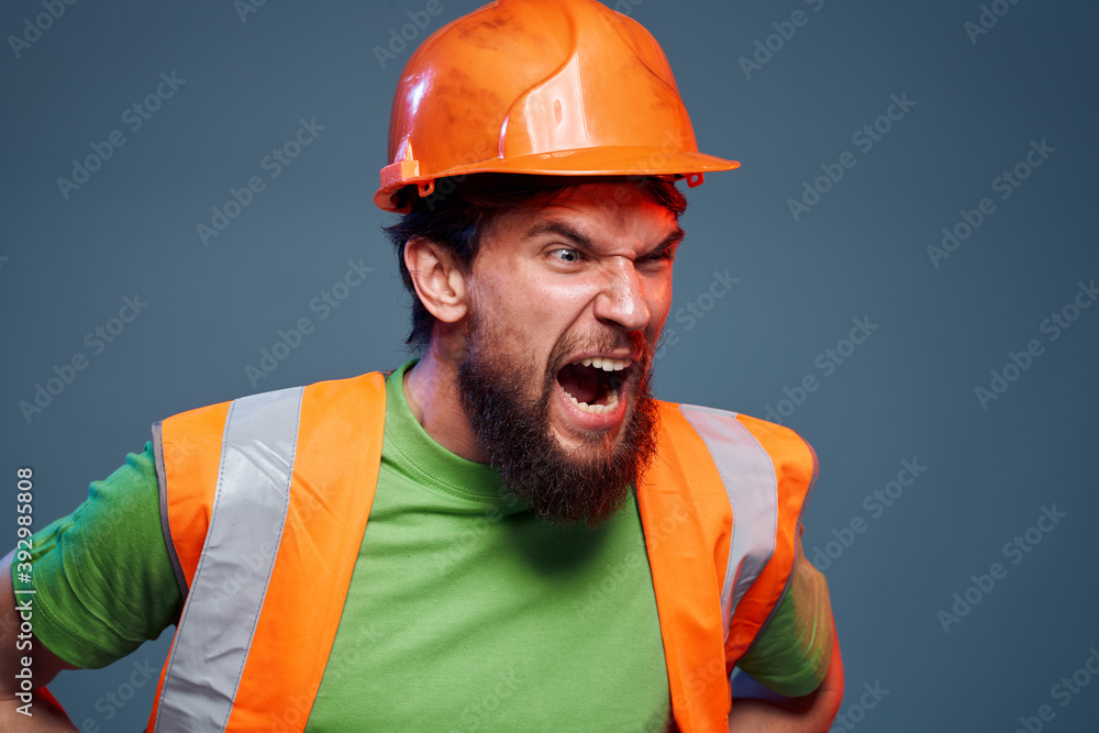 Emotional builders orange hard hat safety work fatigue blue background Emotional builders orange hard hat safety work fatigue blue background