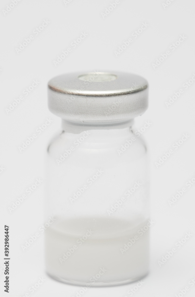 vaccine in glass taro, closed isolated on white background vaccine in glass taro, closed isolated on white background