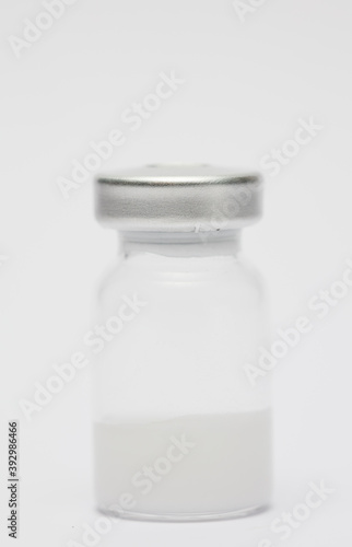 vaccine in glass taro, closed isolated on white background