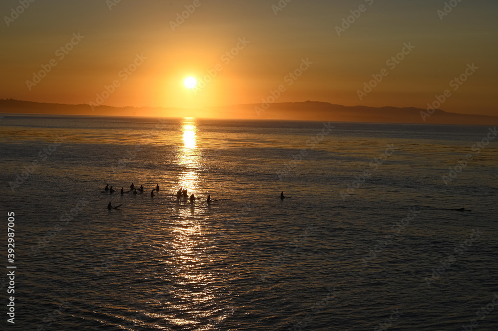 surfers at sunrise