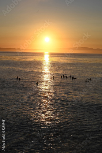 surfers at sunrise © chrissie