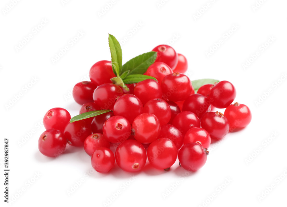Pile of fresh ripe cranberries with leaves on white background Pile of fresh ripe cranberries with leaves on white background