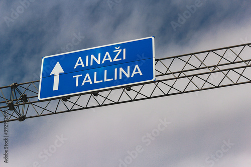 Blue metallic road sign direction to Ainazi and Tallinn, Estonia. photo