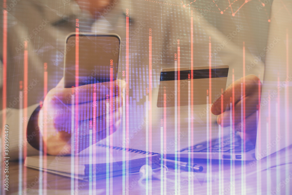 Double exposure of man hands holding a credit card and Forex graph drawing. Stock trading and digital fintech in Internet E-commerce concept. Double exposure of man hands holding a credit card and Forex graph drawing. Stock trading and digital fintech in Internet E-commerce concept.