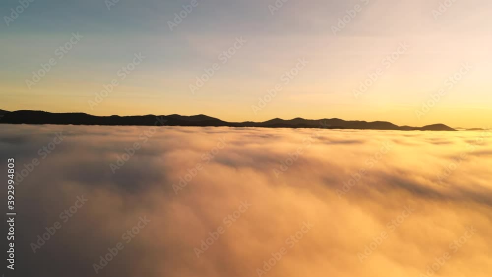 Sunrise over low clouds. Wonderful morning landscape. Sunrise over low clouds. Wonderful morning landscape.