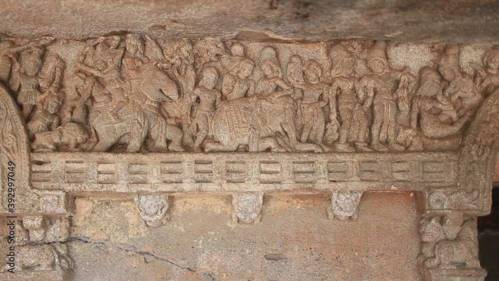 Slow upward pan of hard carved temple in Sri Lanka Slow upward pan of hard carved temple in Sri Lanka