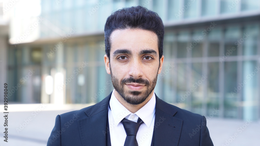 Smiling arabian businessman in the city. Smiling arabian businessman in the city.