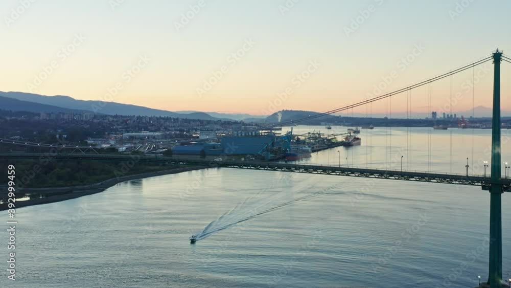 Stunning Drone Shot at Lions Gate Bridge, Vancouver showing land and marine traffic Stunning Drone Shot at Lions Gate Bridge, Vancouver showing land and marine traffic