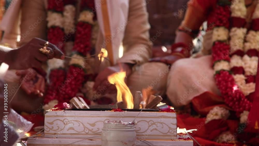 ongoing rituals at an Indian hindu wedding ceremony infront of holy ...