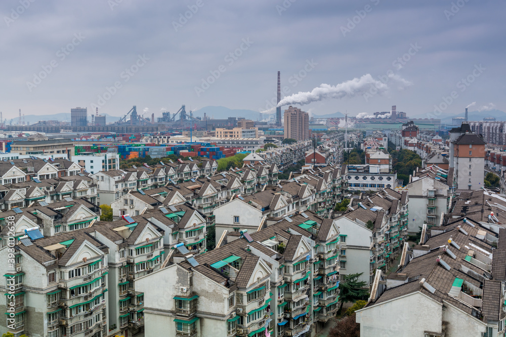 Modern residential area with background of smoke pollution in Ningbo City, Zhejiang, China