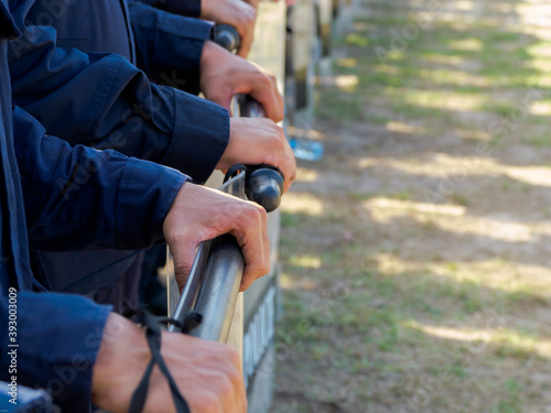 Riot police practice shields and baton
