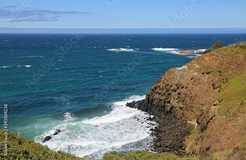 Pyramid Rock behind cliff - Phillip Island, Victoria, Australia